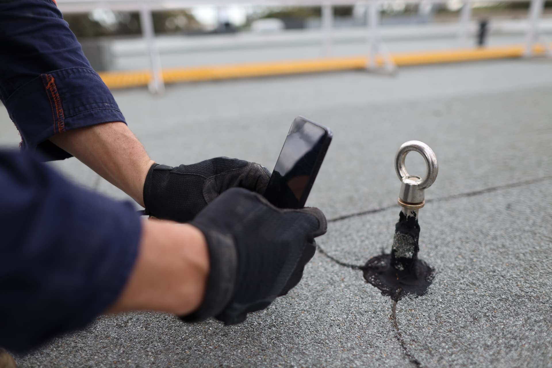 Roofing professional recording roof conditions on a phone