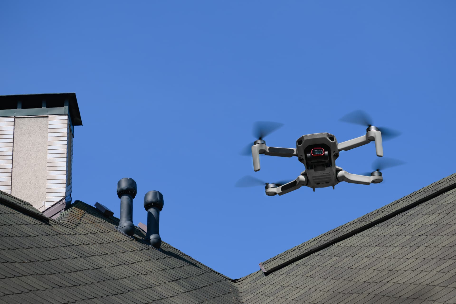 Drone photographing residential rooftops