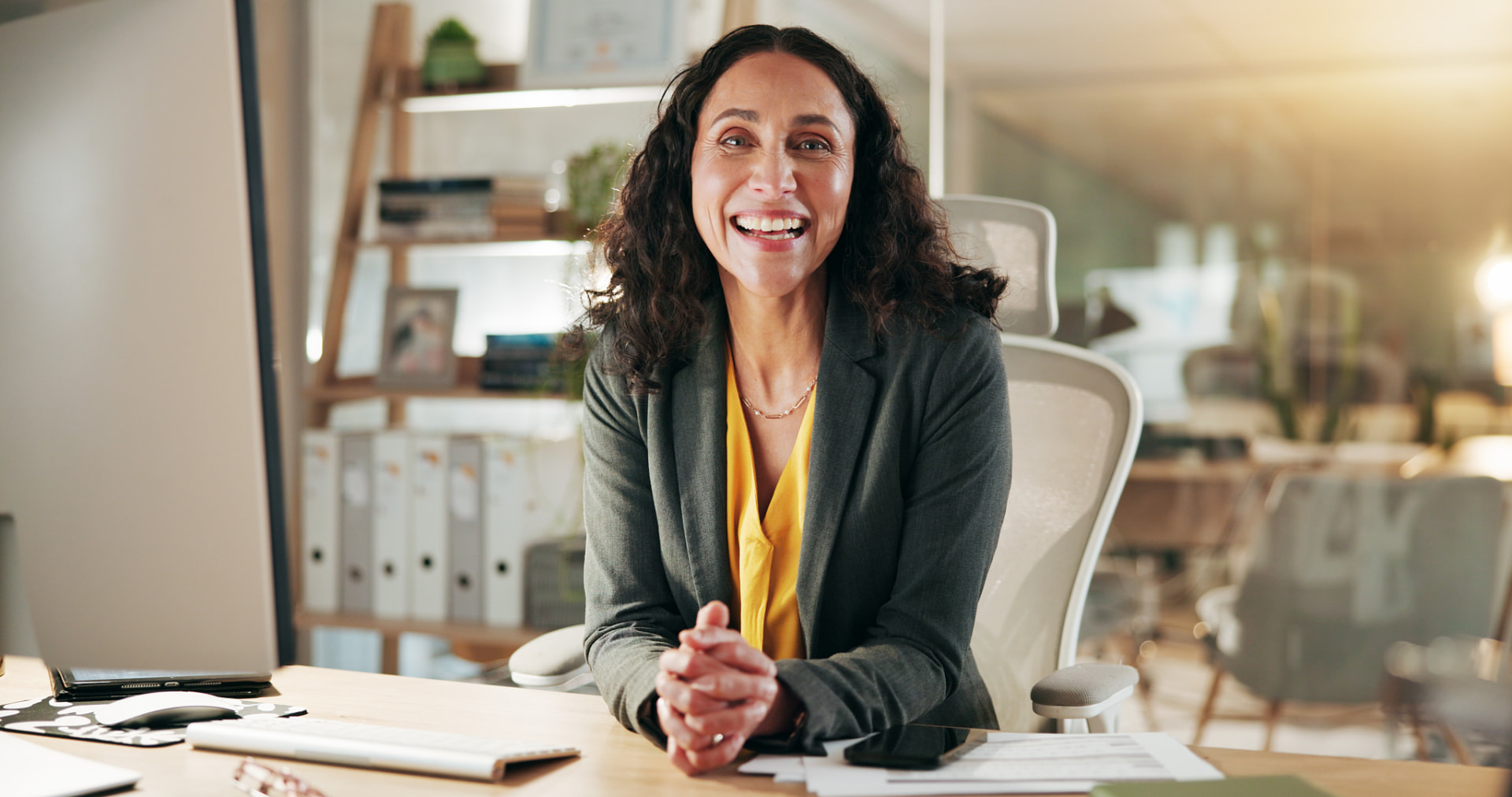 Property professional at her desk in an office